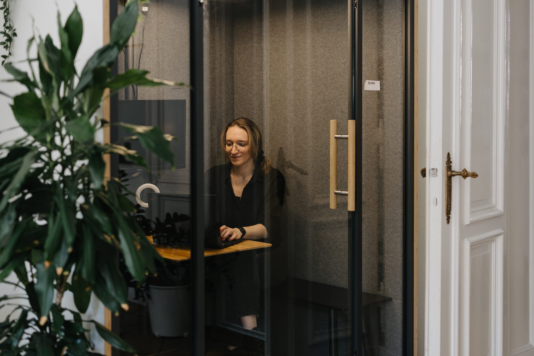 A Gemmpion taking a client call in one of our phone boxes