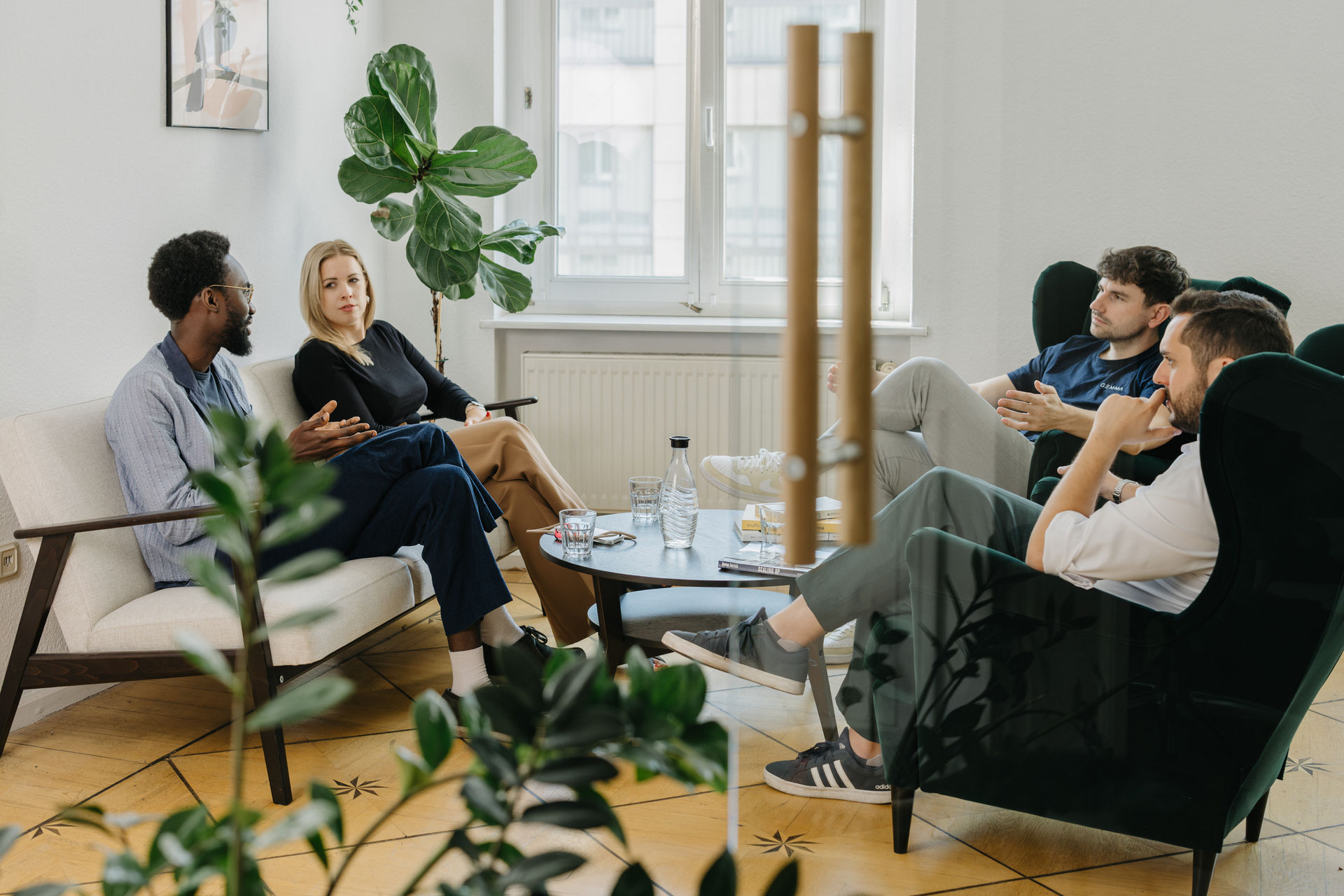 The Gemma Analytics team talking in the office lounge